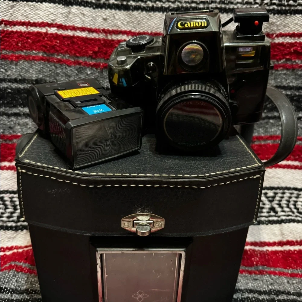 Canon Black and Silver Camera with Detachable Flash